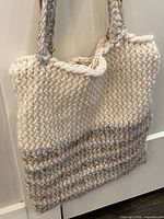 Front view of crocheted tote bag hanging