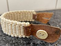 Angled view of bracelet showing bead construction and leather ends