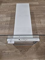 Top view showing matte white flue and glass canopy