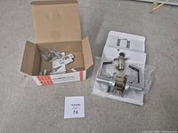 Entire contents: boxed hardware and lever set laid out