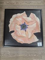 Front view of square poppy canvas print in black frame