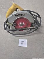 Full view of DeWalt circular saw showing blade, guard, handle and cord