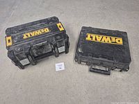 Both DeWalt cases closed showing logos and overall wear