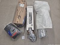Overall lot: four duct items including two boxed 4 in flex ducts, bagged 5 in flex duct, rigid sleeve