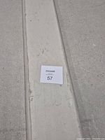 Close view of board surface with lot card