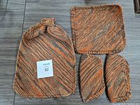 Full view of all four knitted pieces laid out together