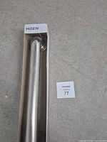 Moen grab bar in open end of retail box