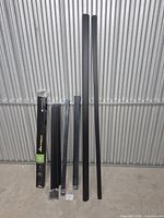 Full lot showing boxed rail kit, loose rails, pickets, and channel