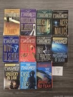 Front covers of all eleven paperbacks laid out