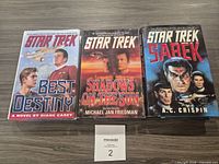 Front covers of the three Star Trek novels laid out side by side
