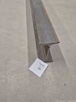 Close view of I-beam end showing flange and web