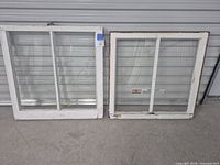 Front view of both windows leaning against wall