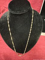 Full view of sterling silver wheat chain on display bust