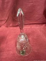 Full view of crystal hand bell standing upright