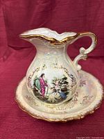 Creamer on underplate front view showing shape, glaze, and design