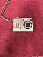 Front view showing lens, flash and model marking