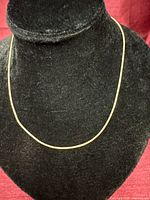 Full view of snake chain necklace on bust