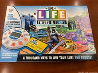 Box top showing title, artwork, age rating 9+