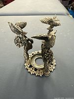 Top angled view showing overall structure with birds and base detail