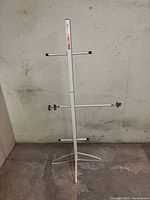 Full view of vertical drying rack with tripod base and crossarms