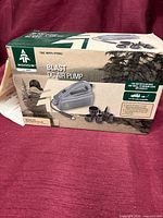 Front of boxed Woods Blast DC Air Pump showing product image and branding