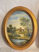 Full view of framed oval painting
