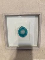 Front view of framed agate slice art showing full piece