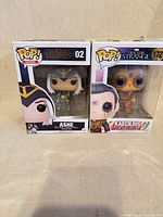 Front view of both boxed Funko Pop figures