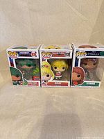 Front view of all three boxed Funko Pop figures