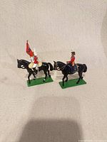 Front view of both mounted cavalry figures