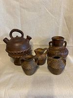 Group shot of all five terracotta vessels