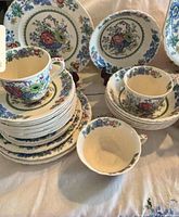 stacked plates, bowls, cups showing Strathmore pattern