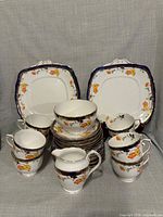 Full 28-piece Roslin porcelain tea set displayed