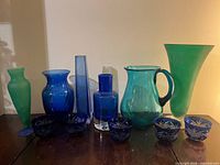 Group shot of entire blue and green art glass lot
