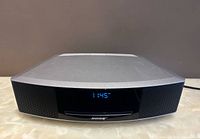 Front view of Bose Wave Music System IV showing display, CD slot and speakers