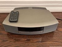 Top view of Bose Wave Music System with remote placed on unit
