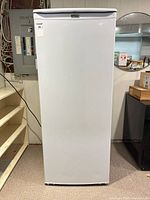 Front view of white Danby Premier upright freezer