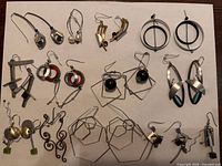 All 15 pairs arranged on white background showing variety of designs