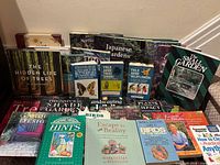 Group shot of entire lot showing variety of gardening, landscaping and nature books arrayed upright and stacked