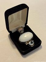Pendant in presentation box showing moonstone and aquamarine stones