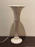 Full view of alabaster table lamp showing height, shape and power cord