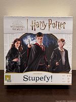 Front of Stupefy! game box with characters and logos