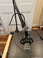 Microphone mounted on boom arm showing overall setup