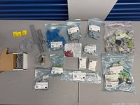 Overview of all bags, box and DIN rail pieces on table