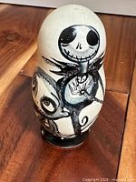 Front view of largest nesting doll with Jack Skellington artwork
