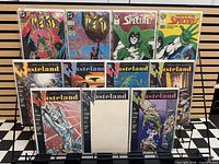 Front view of rack showing multiple comics including The Weird, Wrath of the Spectre, Wasteland issues