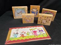 All five stamps and sealed card displayed