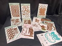 Overview of 12 packaged Spellbinders Glimmer hot foil plate sets and die set