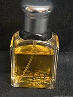 Front view of Tuscany Per Uomo bottle with cap, showing overall design and fill level