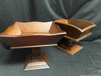 Both wooden pedestal bowls side by side to show overall form and size